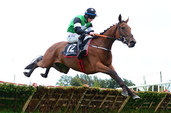 Smiling Eliza and Jack Kennedy pictured on their way to victory