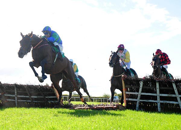 Try Again jumps the last in fourth before powering home to score under Robbie Power