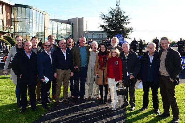 Trainer Willie McCreery (centre) and members of the Irish National Stud Breeding & Racing Club 