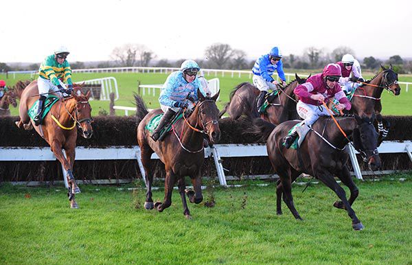 De Name Escapes Me (left) clears a fence under Niall Madden