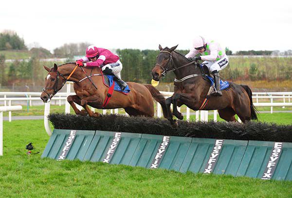Salsaretta (right) jumps the last 