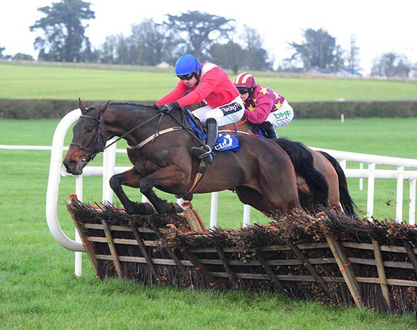 Allaho (Ruby Walsh) leads Minella Indo at the last