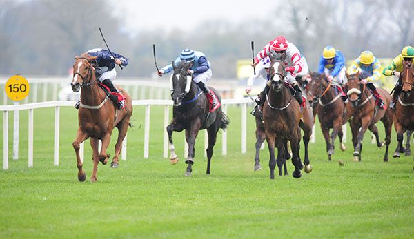 Jon Ess (left) is ridden out by Tom Madden to beat Cork Harbour (red and white)