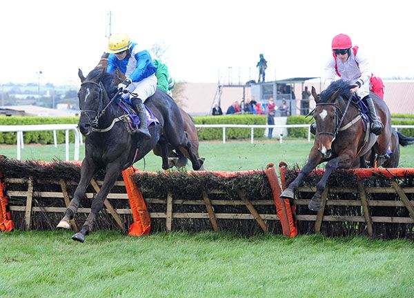 Trenchtown Rock (left) leads Creasted Court over the second last