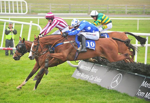 Colenso and Danny Mullins (near) jump the last with One In All In with Buttons And Bows close behind