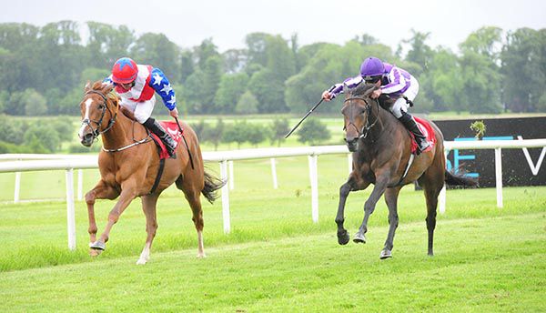 Flowering Peach (Seamie Heffernan, nearside) comes through to beat Angel's Amy (Gary Carroll)