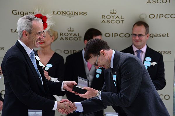 Aidan O'Brien bows to Ruby Walsh upon accepting his prize after the success of South Pacific 