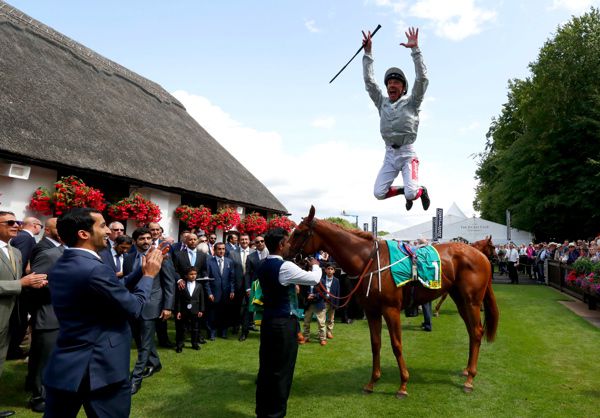 Frankie Dettori does his trademark flying dismount from Raffle Prize
