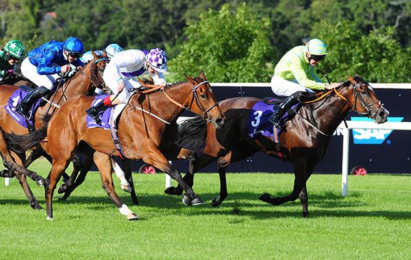 Suaimhneach and Luke McAteer (nearest) come to claim Highly Approved 