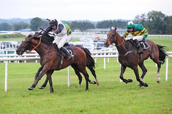NA TRACHTALAI ABU (centre) and jockey Jonathan Burke win the Axa Smart Farm Insurance Midlands National Handicap Chase