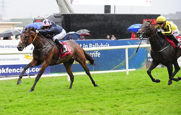 LAUGHIFUWANT and Seamie Heffernan (left) win the 'Ahonoora' Handicap from On A Session.
