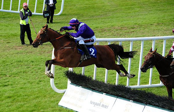 BLACKHILLSOFDAKOTA (left) and JJ Slevin jump the last.