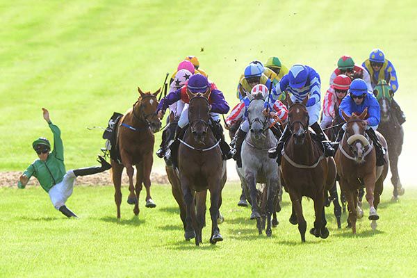 A slipped saddle sees Charlie O'Dwyer off in a race that went to High Altitude and Aaron Mackay (left)