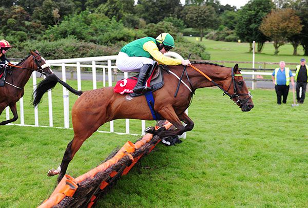 Lucky Road and Jonathan Moore jump the last 