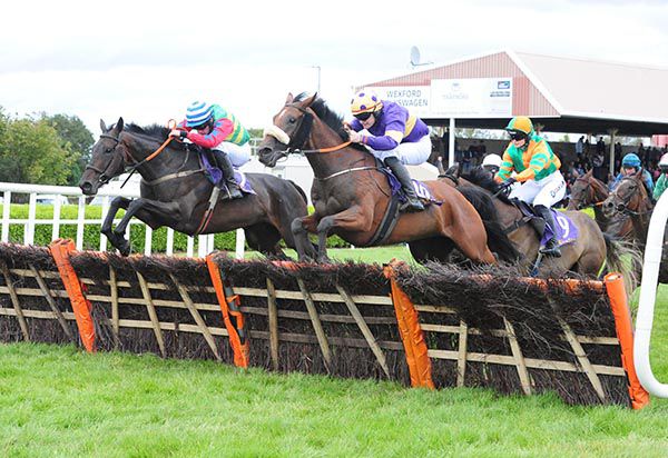 Shes Flat Tothemat, left, jumps the last with Lady Of The Sea