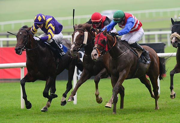 One Cool Poet, right, rattles home in the Curragh