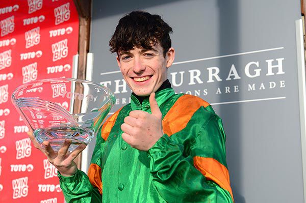 Joey Sheridan, rider of Royal Illusion, pictured with the Tote Irish Cesarewitch trophy