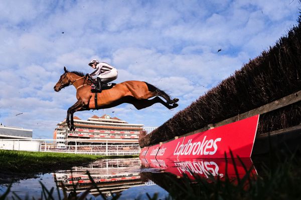 Danny Whizzbang clears the water jump at Newbury