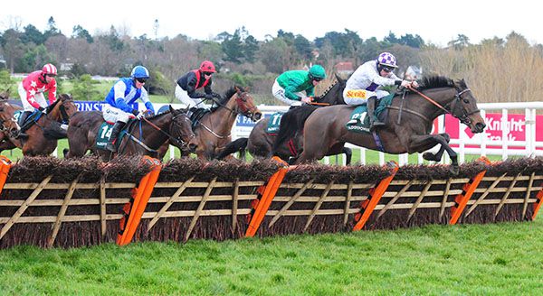 Leagan Gaeilge (white and purple) jumps the last in front