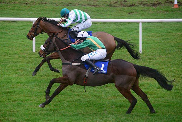 Benefit Run (nearside, hangs left with Rachael Blackmore) as Bridge Native and Conor Orr prevail