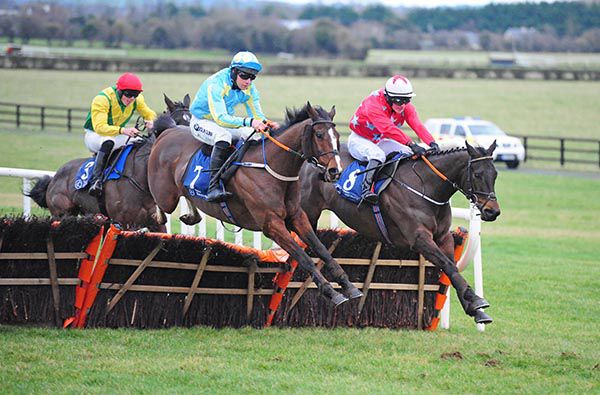 Abraham and Conor Brassil (light blue and yellow) saunter through to win the penultimate event at Naas