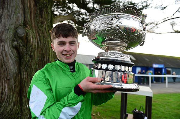       Aidan Kelly holds aloft the Molony Cup