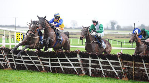 Strange Notions (Sean Flanagan) is hampered at the last as Paul Townend (green and white) comes to win on Jazzaway