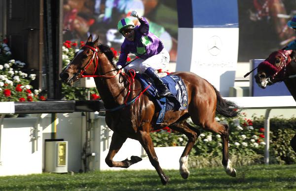 Douglas Whyte salutes his 2012 Derby success aboard Fay Fay