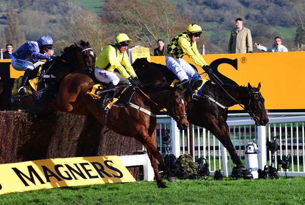 Lostintranslation (near side) jumps the last upsides winner Al Boum Photo in the 2020 Cheltenham Gold Cup