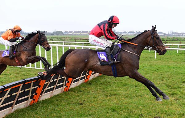 Ujumpthelastuwin (Johnny Moore) heads for home from Rebel Gold (Paddy Kennedy)