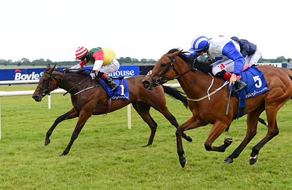 Acquiescent (left) and Killlian Leonard defeat Lilandra (near side) in the 6f Fillies' Maiden