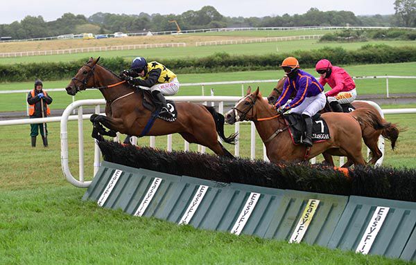 Aprils Joy and Jonathan Moore clear the last 