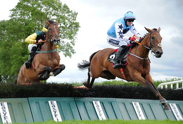 Empirion and Keith Donoghue (right) jump the last ahead of Dave And Bernie