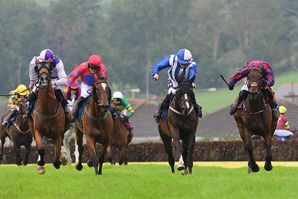 Mary Fields (second from right) is ridden out by Mikey Hamill to fend off all challengers