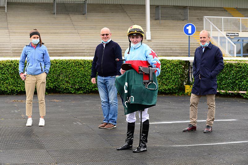 A Step Too Far and Adam Farragher won for trainer Kieran Cotter (right) his assistant Danny Murphy and daughter Grainne 