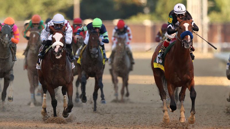Authentic and John Velasquez (right) win the Kentucky Derby from the favourite Tiz The Law (white noseband)