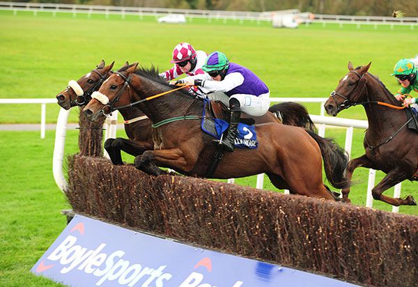 Rueben James (Ryan Treacy, nearside) jumps with Lunch In Adare (Kevin Sexton) and Baily Thunder (Phillip Enright)