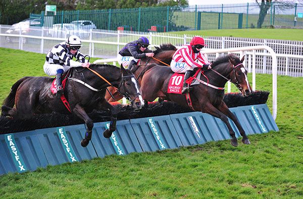 Jiving Jerry and Rachael Blackmore (red and white) en route to victory