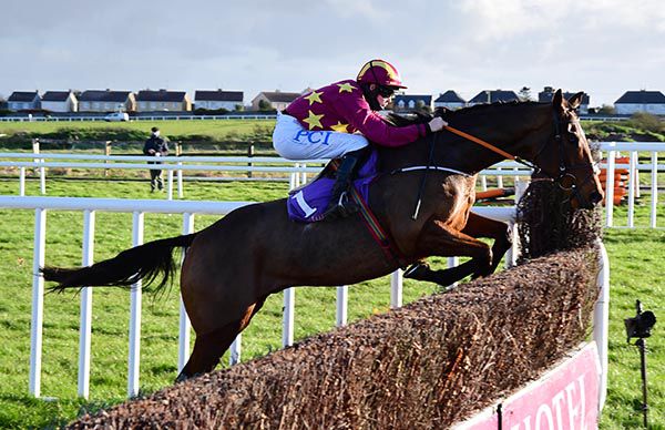 Minella Indo and Rachael jumping a fence at Wexford