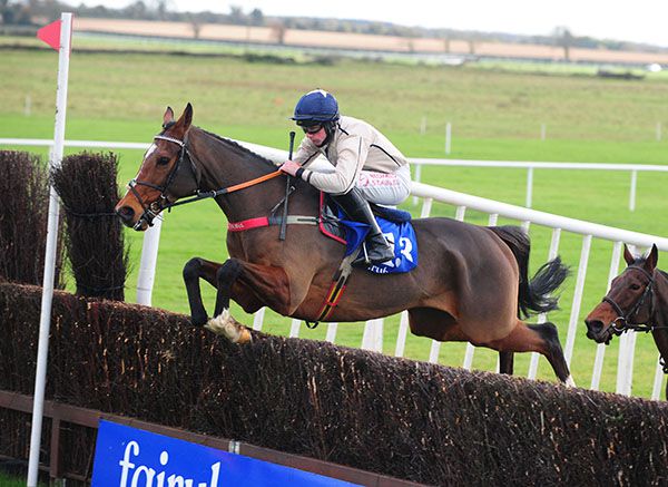 The Echo Boy and Conor Maxwell jumping before going on to win the opener at Fairyhouse