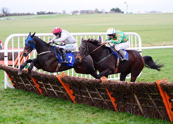 Capture The Action and Sean O'Keeffe (far) jump the last with Caridadi (near)  
