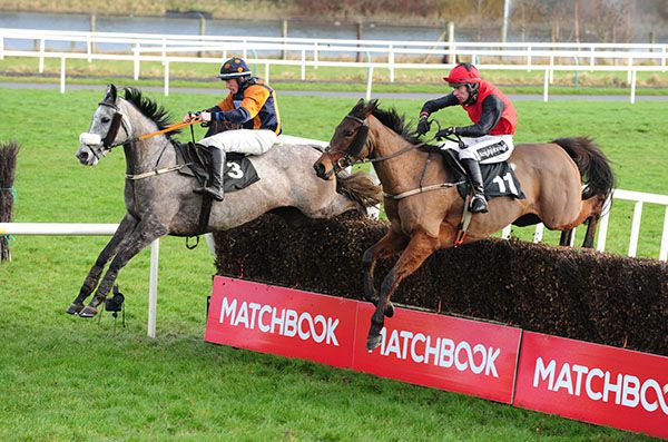Johnnys Girl (near side) and Kristian Goingwel jumping the last