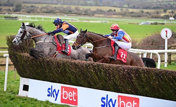 Kristian Goingwel (far side) jumps the last