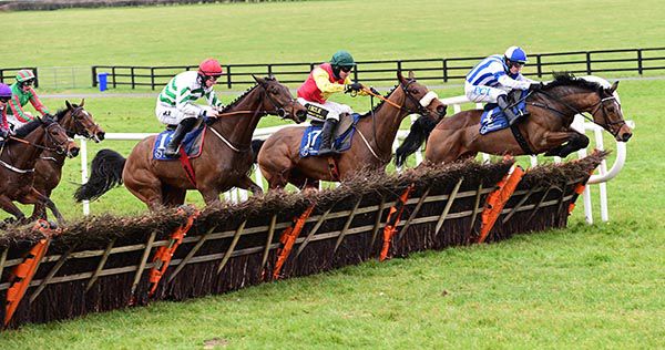 Coltor leads Showbusiness (left) and Zoffanien (centre) at the last 