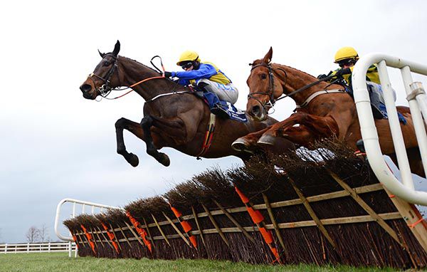 Rachael Blackmore and Paul Townend jump the last in unison in a Maiden Hurdle at Naas last Saturday