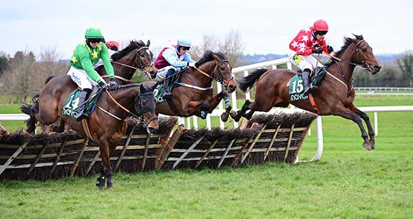 Claret and light blue Donagh Meyler comes with a winning run on Cotteemcavennigoal (centre)