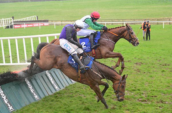 Heather Rocco (far side) jumps the last as Mr Coldstone is about to fall