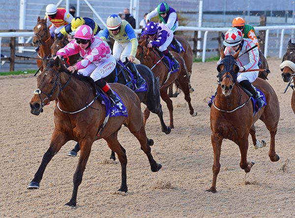 Pink and white silks Siobhan Rutledge wins on Falak