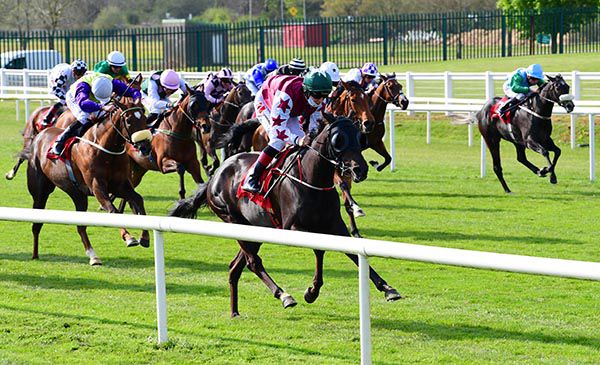 International Lady (near side) is clear of the field under Colin Keane