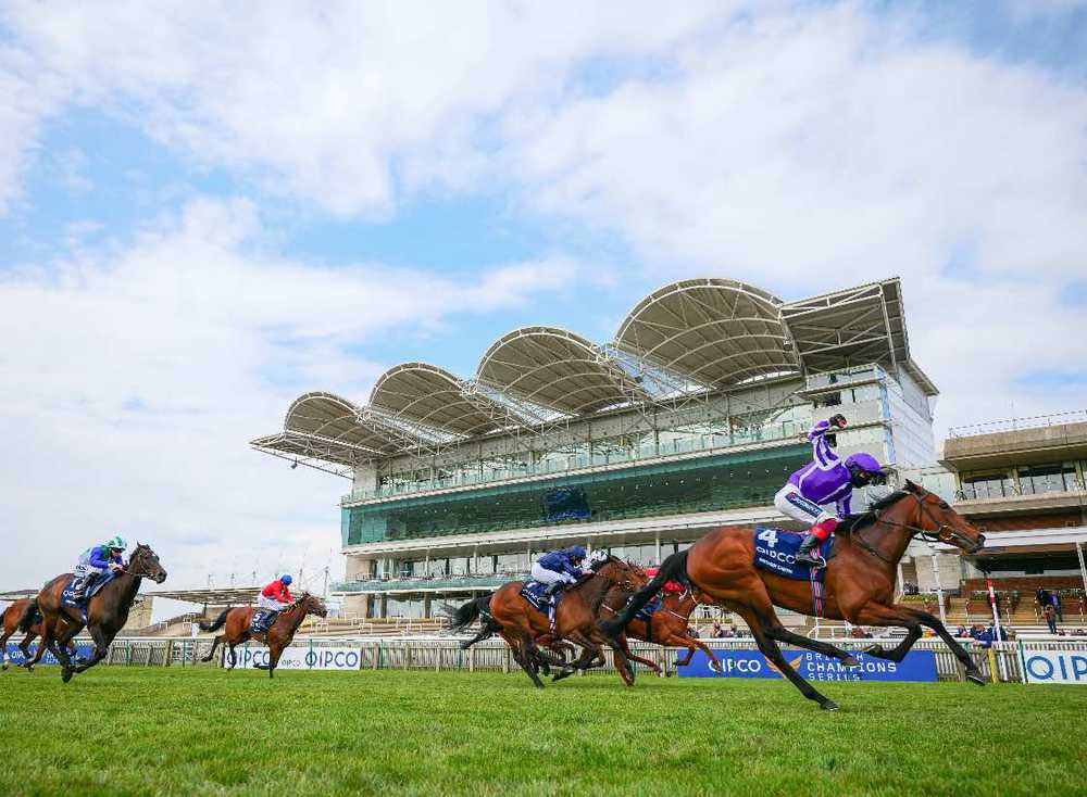 Frankie Dettori punches the air as Mother Earth wins the Qipco 1000 Guineas